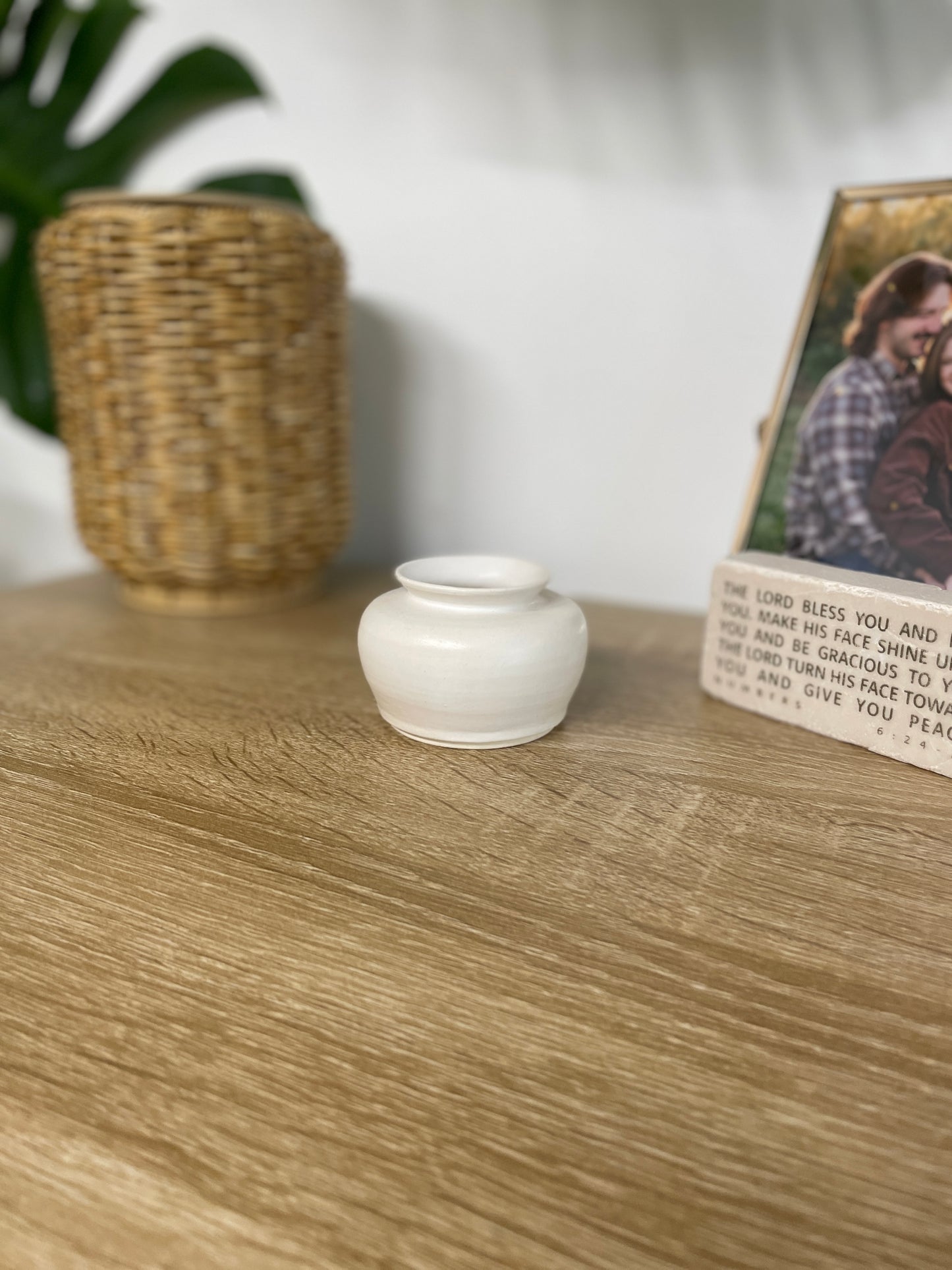 Matte white colored small ceramic bud vase