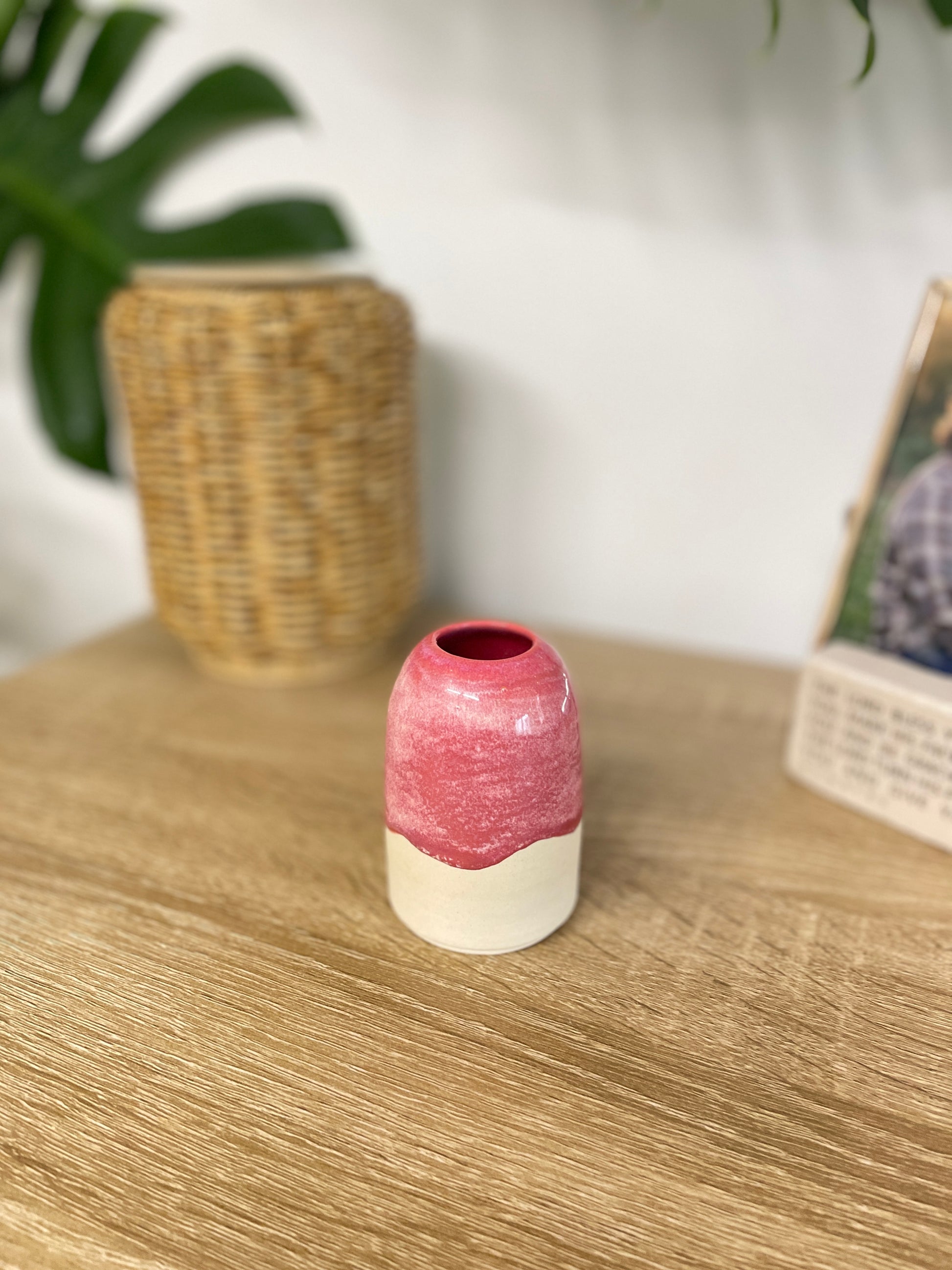 Hot pink colored small ceramic bud vase