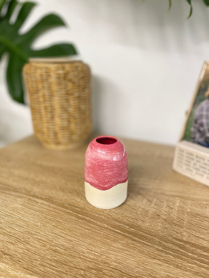 Hot pink colored small ceramic bud vase
