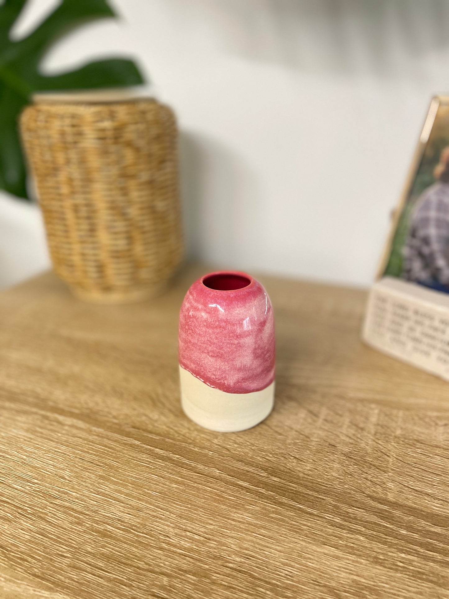 Hot pink colored small ceramic bud vase