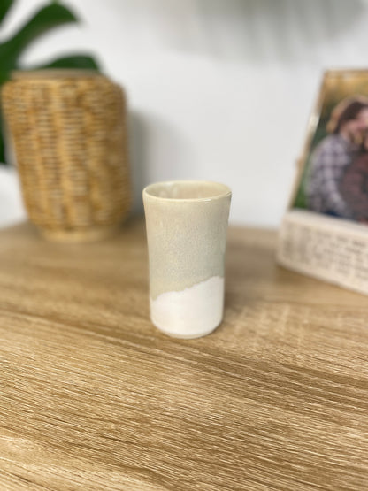 Light sage green and eggshell colored small ceramic bud vase