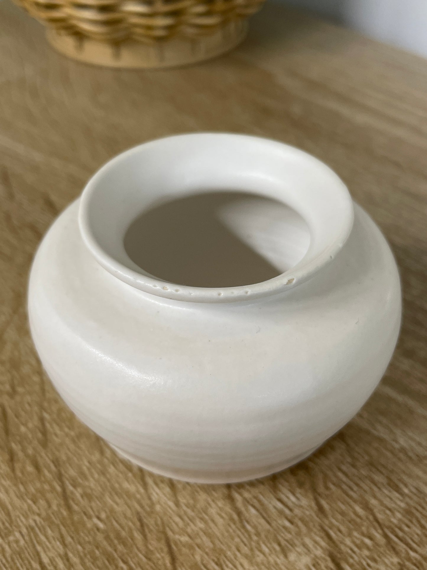 Matte white colored small ceramic bud vase