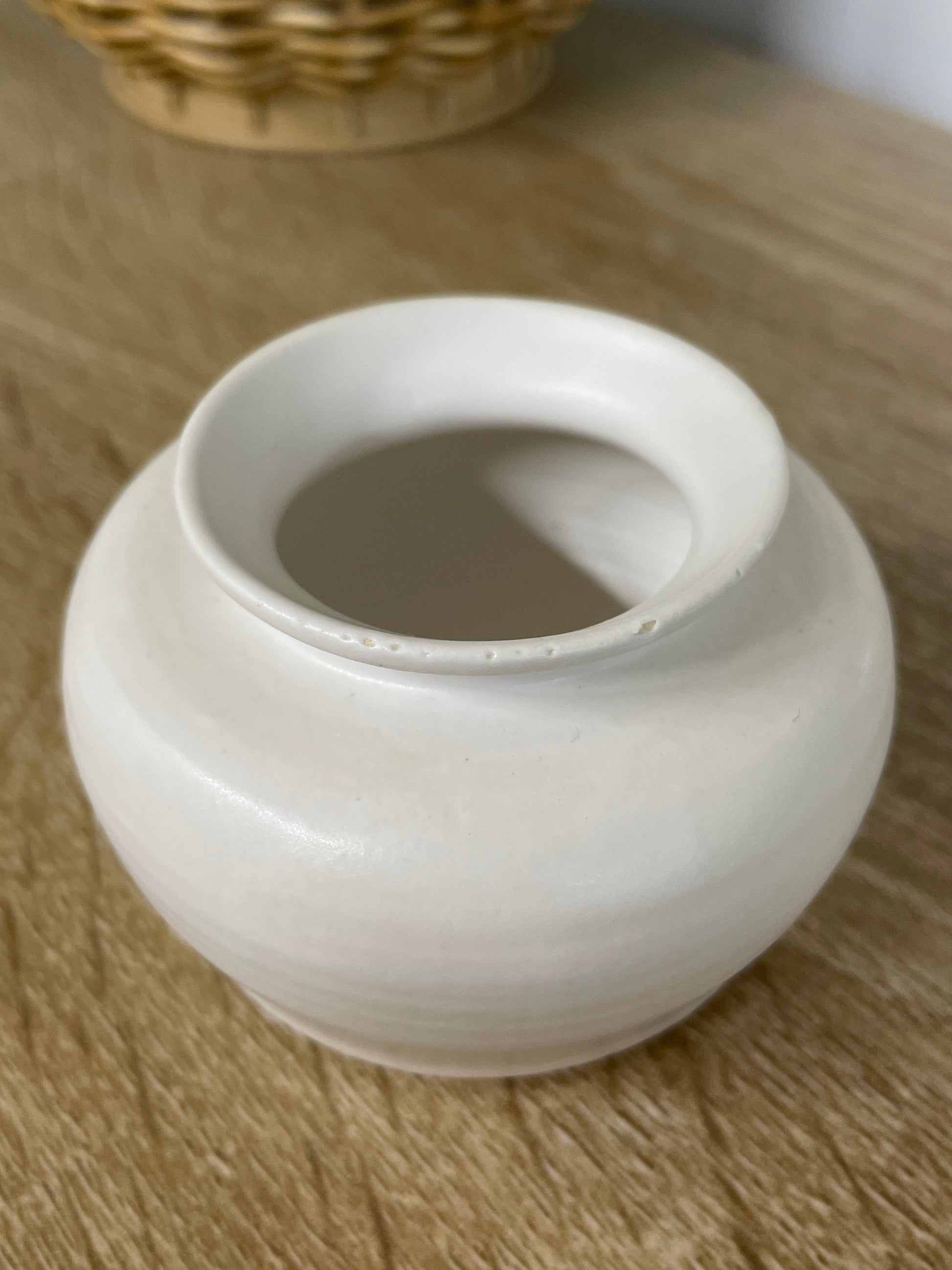 Matte white colored small ceramic bud vase