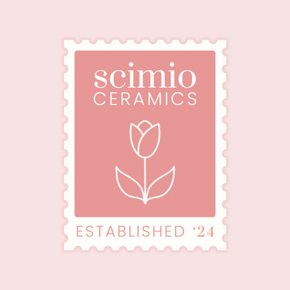Scimio Ceramics logo in the style of a postage stamp with a tulip illustration on a pink background